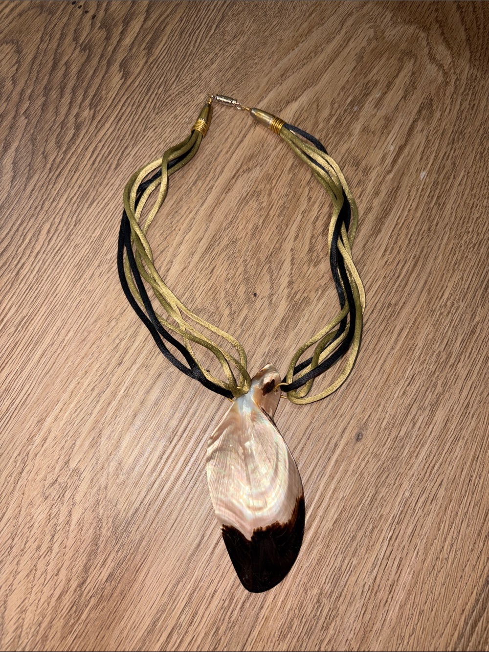 20-Gold and Black Multi-Strand Necklace with Natural Shell Pendant